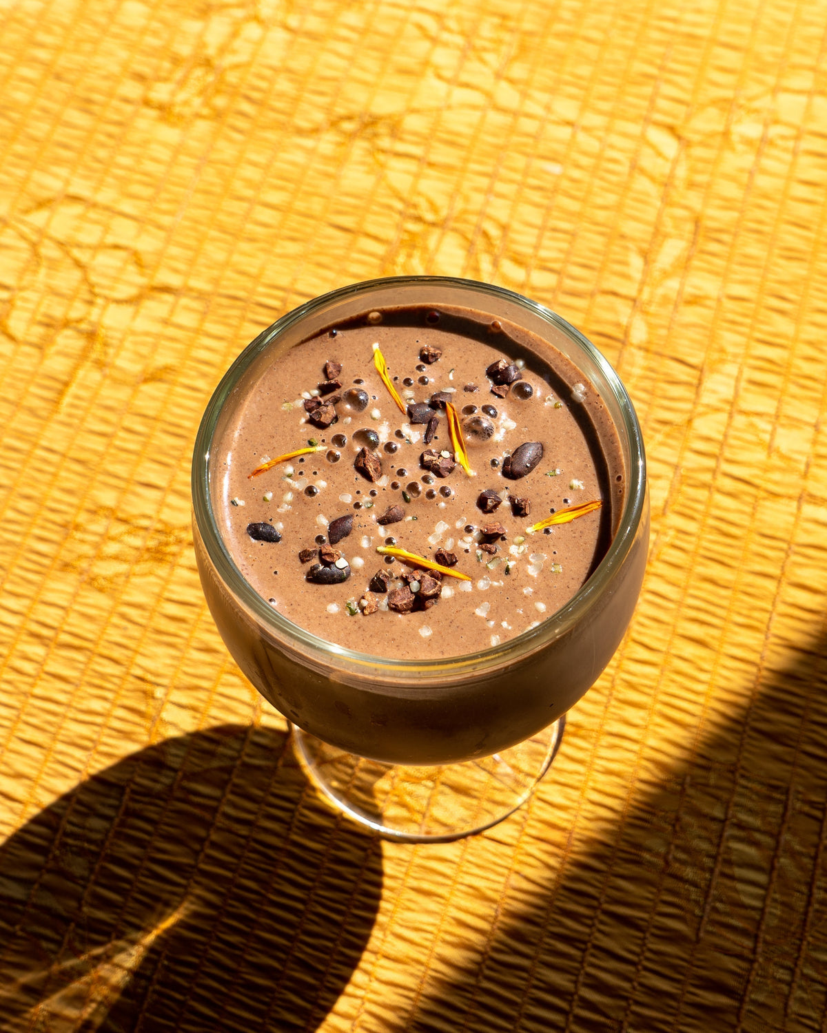 Mocha banana smoothie topped with cacao nibs