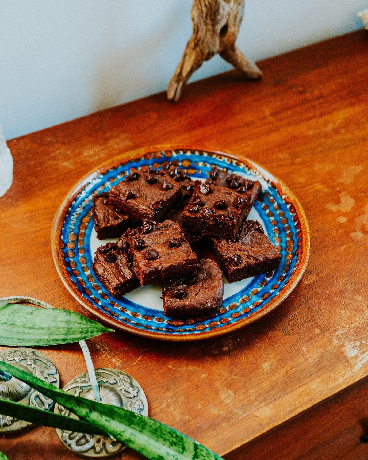 Sweet potato brownies on a decorative ceramic plate
