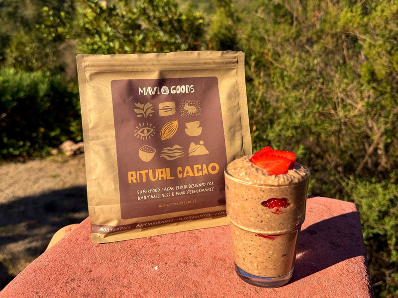 All-Day Energy Oatmeal topped with strawberries next to a bag of Ritual Cacao
