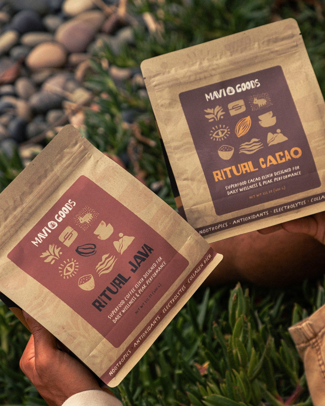 Holding a bag of Ritual Java and a bag of Ritual Cacao outdoors