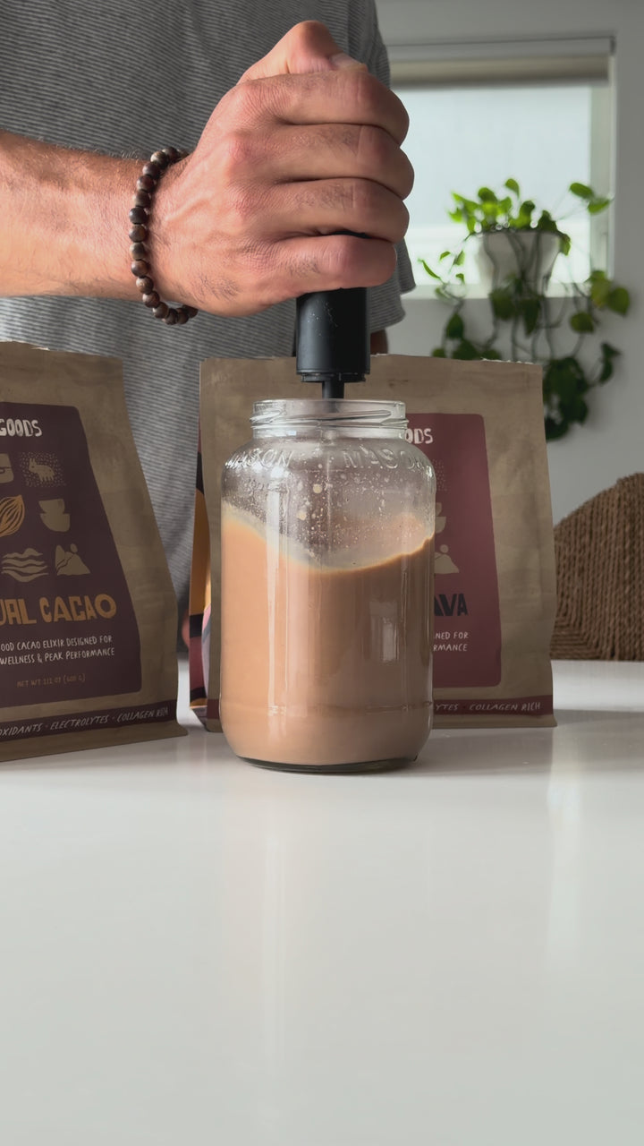 Frothing Ritual Cacao in a mason jar on a kitchen counter